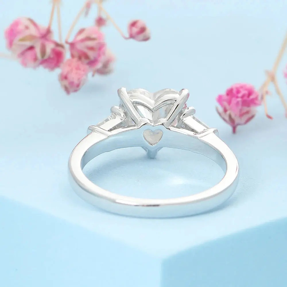 PLATINUM PLATED HEART SHAPED THREE STONE MOISSANITE ENGAGEMENT RING 2CT Moissanite Engagement Rings & Jewelry | Luxus Moissanite